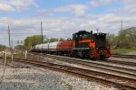 1512 shoves 6 coil cars and its caboose west